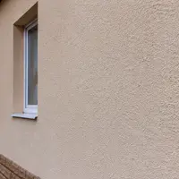 Утеплённый фасад дома с финишным слоем